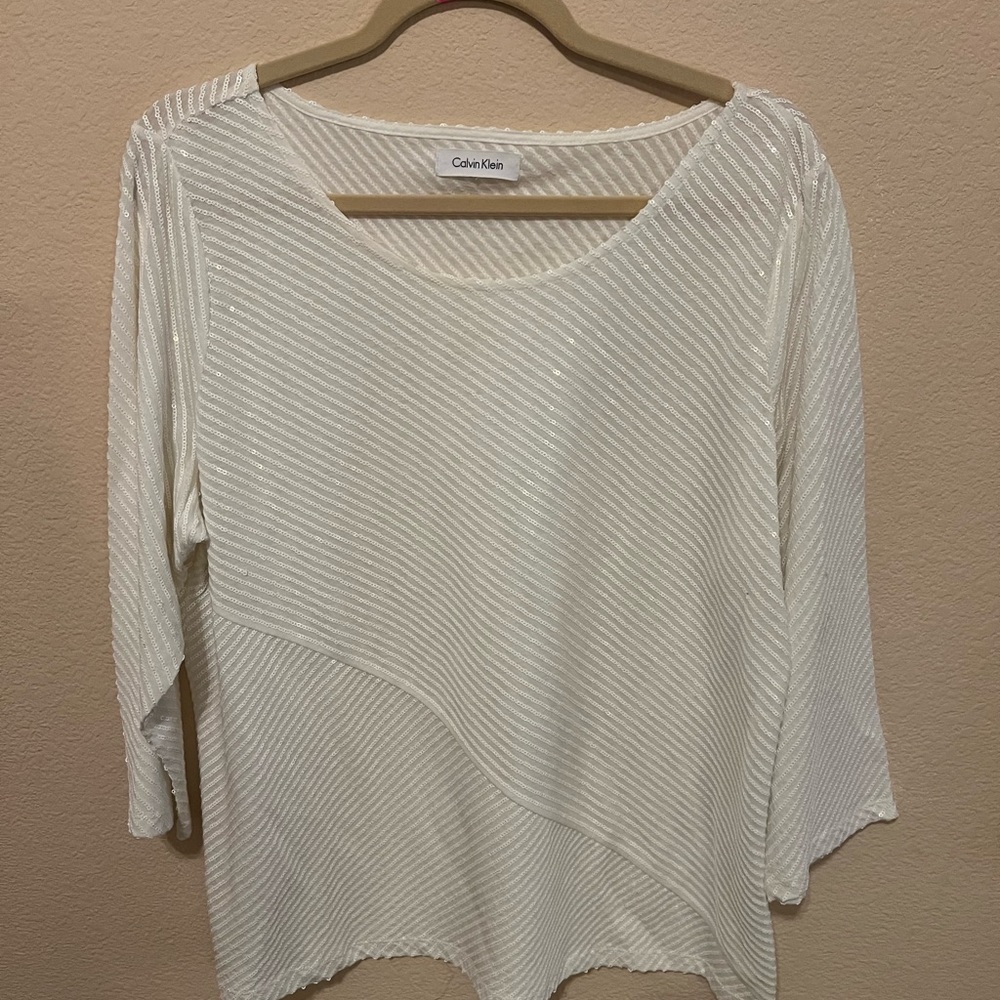 White sparkly top by Calvin Klein